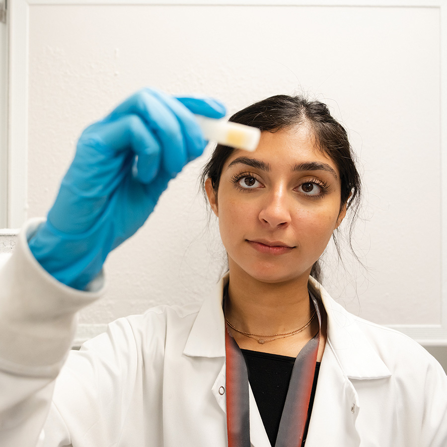 Researcher examines a participant biosample